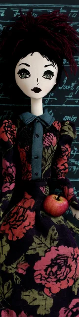 Free teacher bookmark featuring a dark red-haired teacher holding an apple